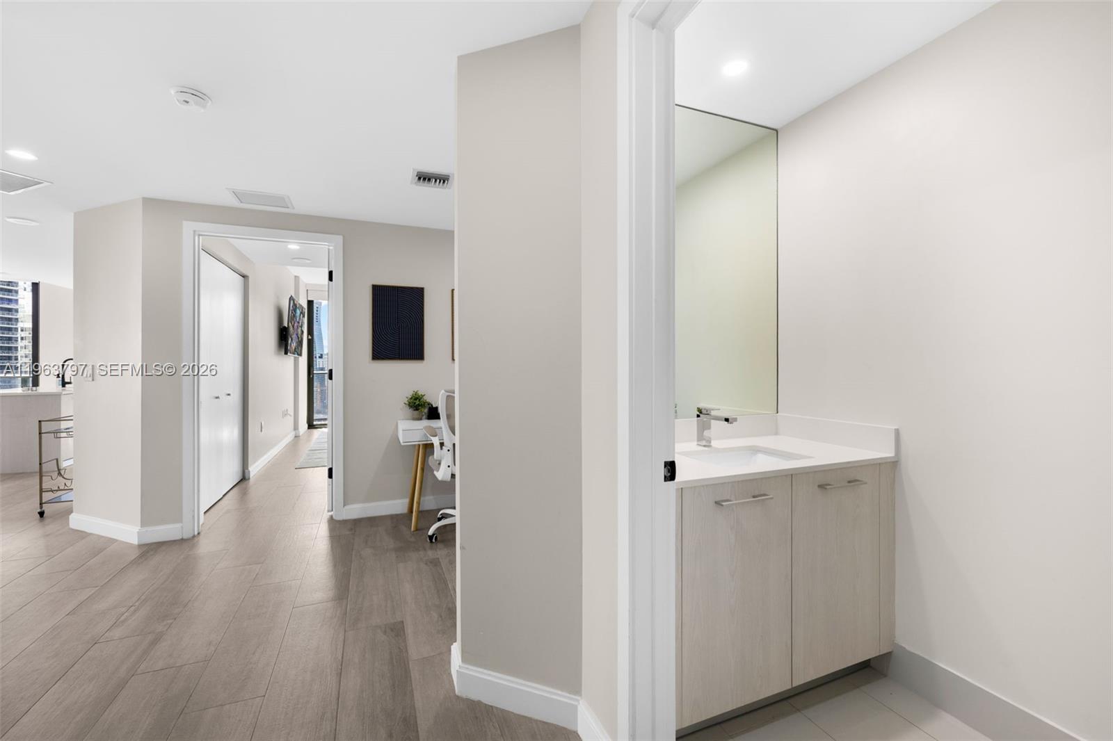 45 Southwest 9th Street, Unit 2803 Miami, FL 33130 - Photo 22 of 66 a view of a hallway with wooden floor