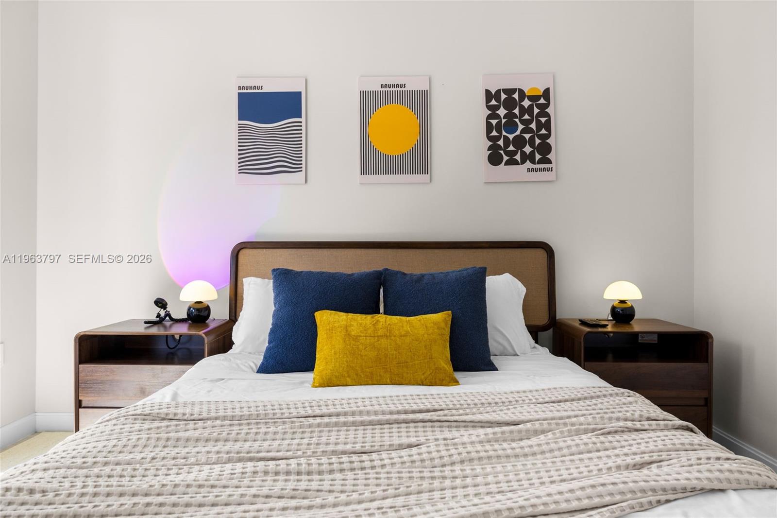 45 Southwest 9th Street, Unit 2803 Miami, FL 33130 - Photo 30 of 66 a bedroom with a bed and lamps