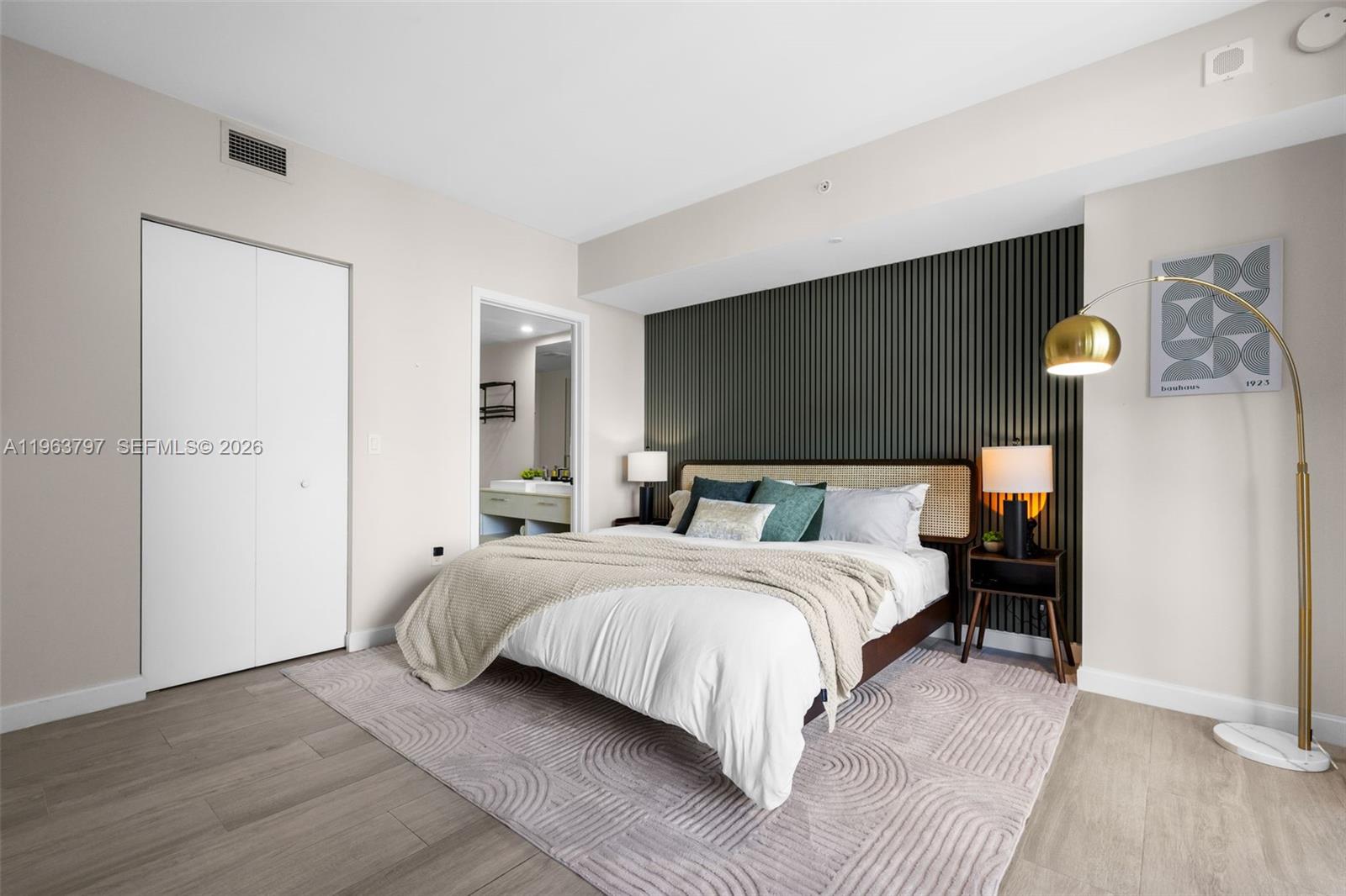 45 Southwest 9th Street, Unit 2803 Miami, FL 33130 - Photo 33 of 66 a bedroom with a bed and a flat screen tv