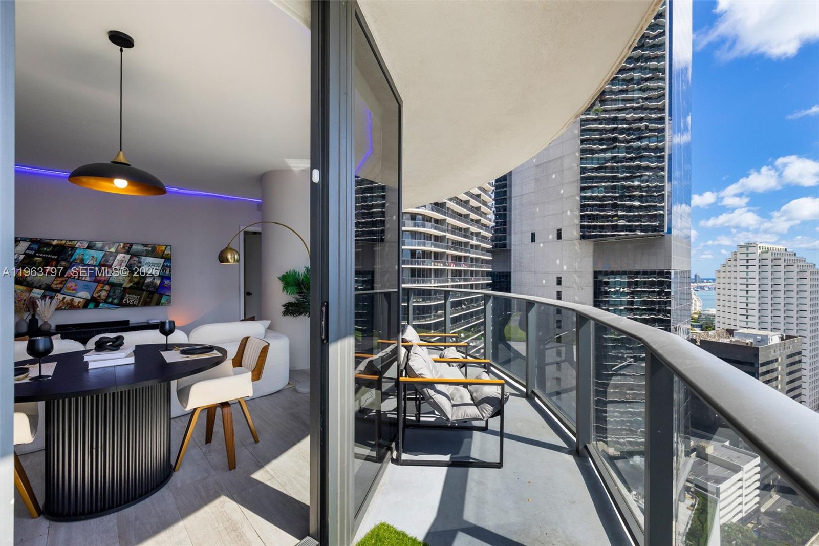 45 Southwest 9th Street, Unit 2803 Miami, FL 33130 - Photo 42 of 66 a view of a balcony with chairs