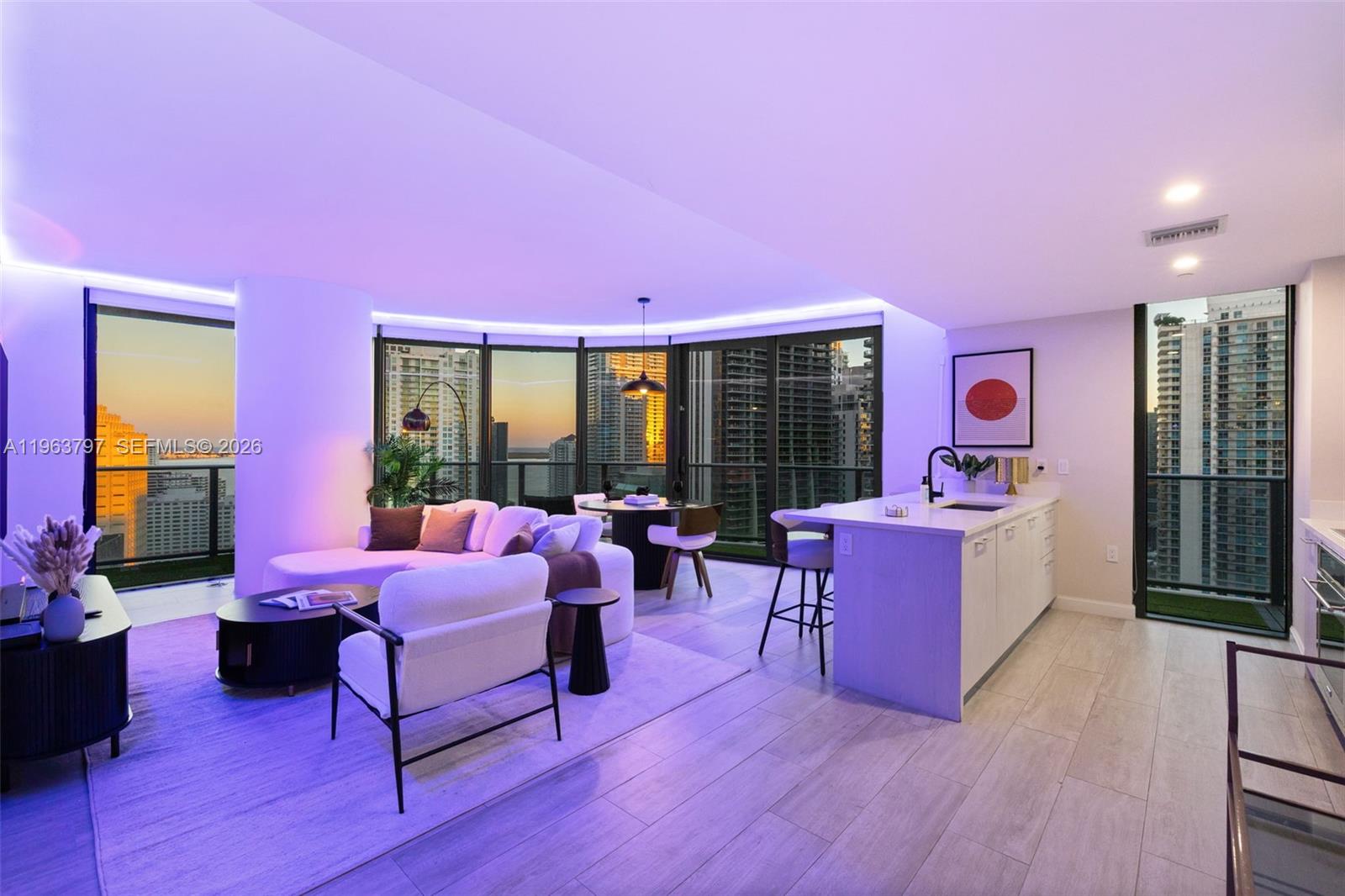 45 Southwest 9th Street, Unit 2803 Miami, FL 33130 - Photo 58 of 66 a bedroom with furniture and a large window