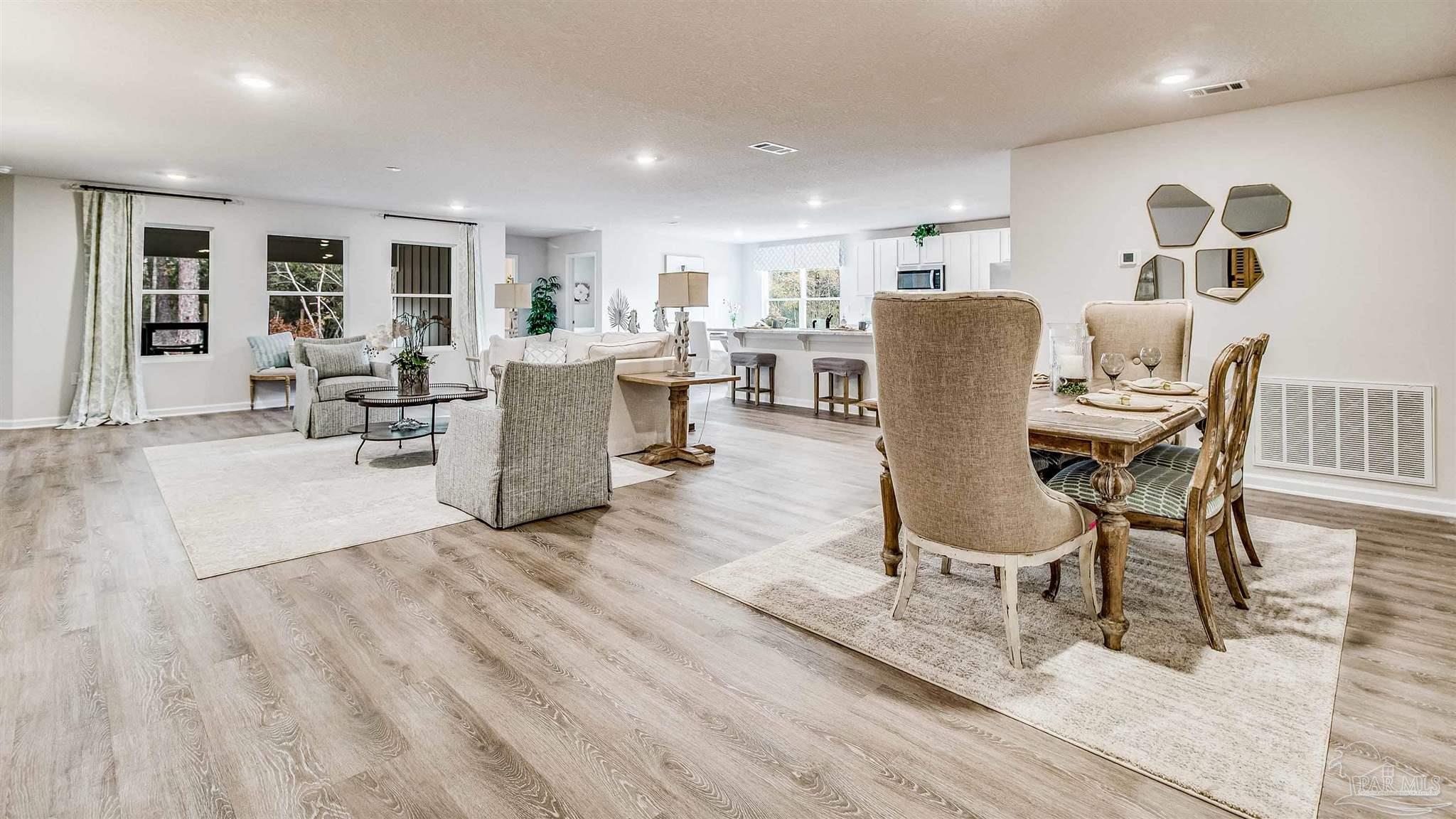 9728 Dutton Lane Milton, FL 32583 - Photo 2 of 31 a living room with furniture and a wooden floor