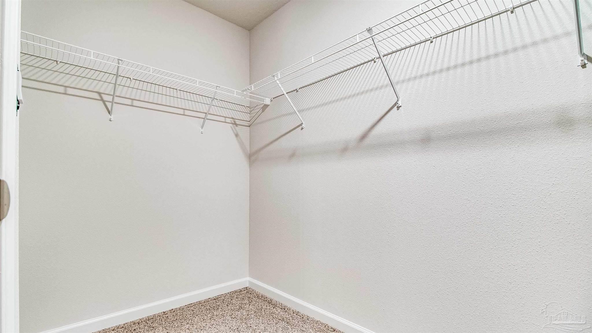 9728 Dutton Lane Milton, FL 32583 - Photo 22 of 31 a view of a room with racks on the wall