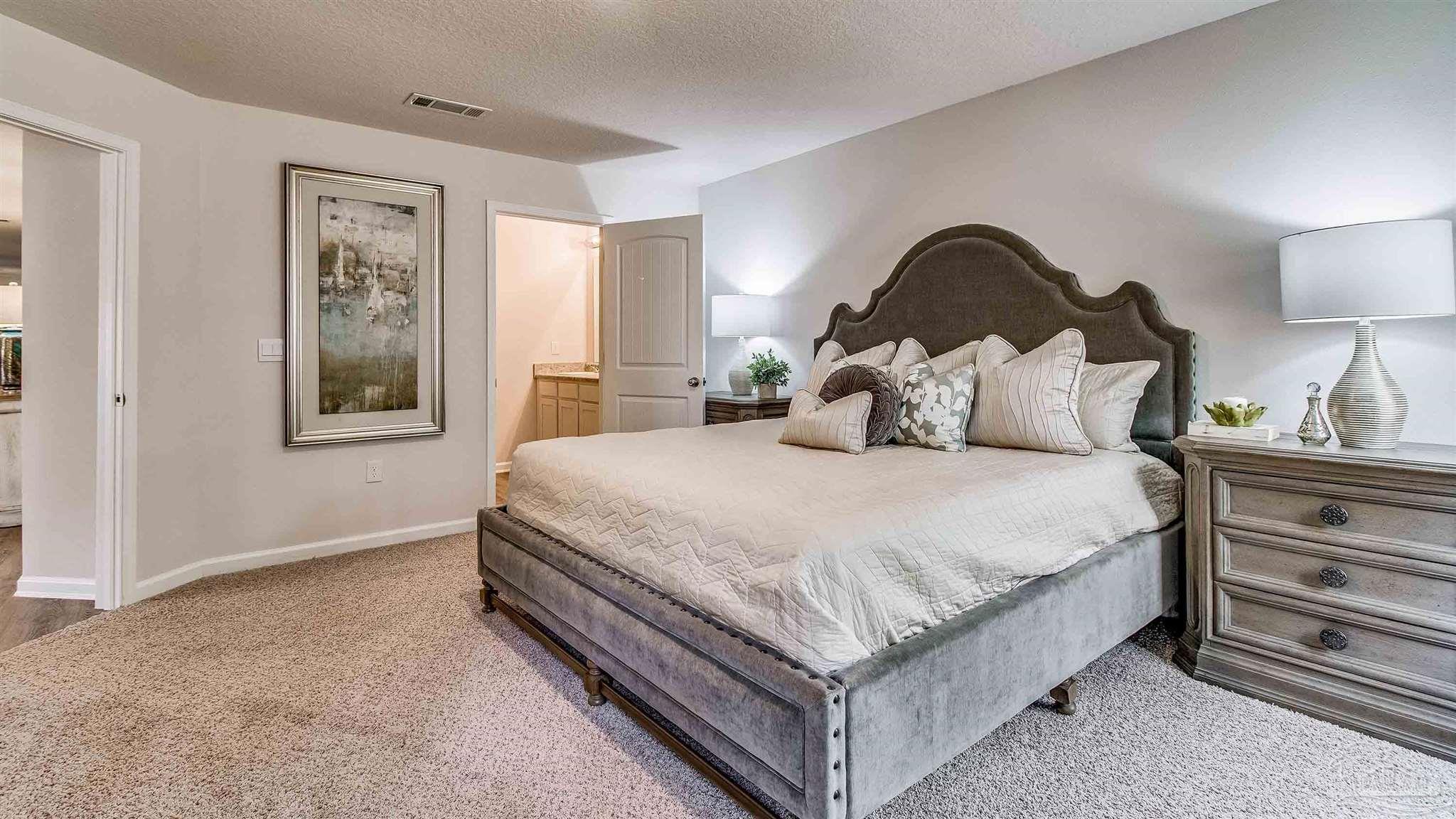 9728 Dutton Lane Milton, FL 32583 - Photo 25 of 31 a bedroom with a bed and a window