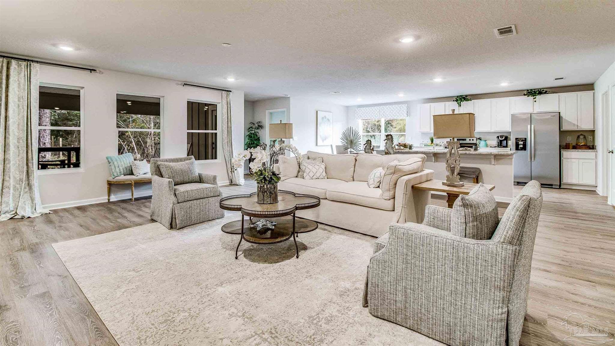 9728 Dutton Lane Milton, FL 32583 - Photo 5 of 31 a living room with furniture and view of kitchen