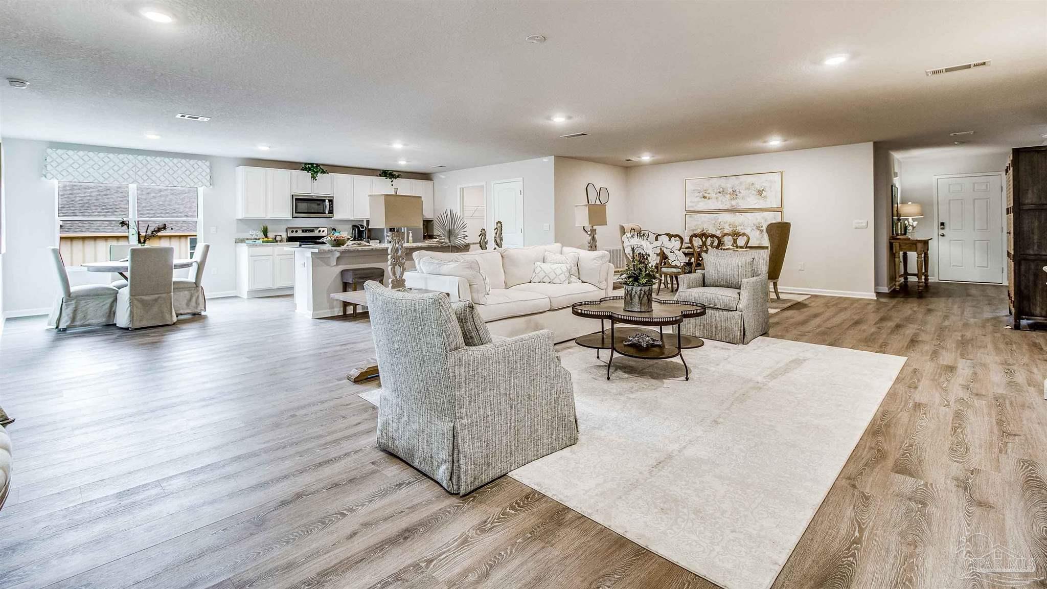 9728 Dutton Lane Milton, FL 32583 - Photo 6 of 31 a living room with furniture and a wooden floor