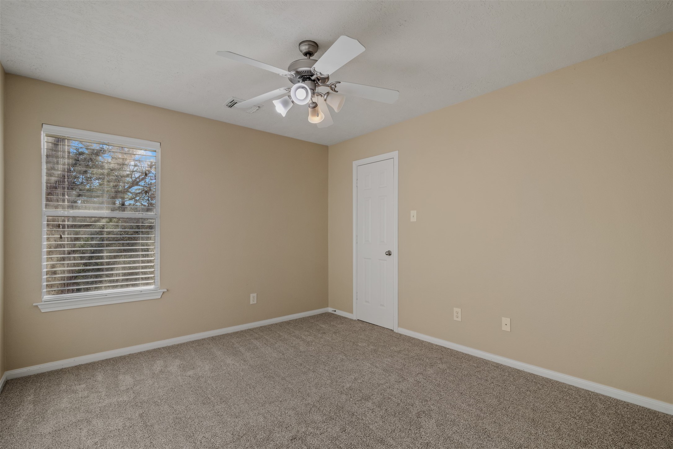 118 Bryce Branch Circle Spring, TX 77382 - Photo 19 of 25 a view of an empty room with chandelier fan and fire place