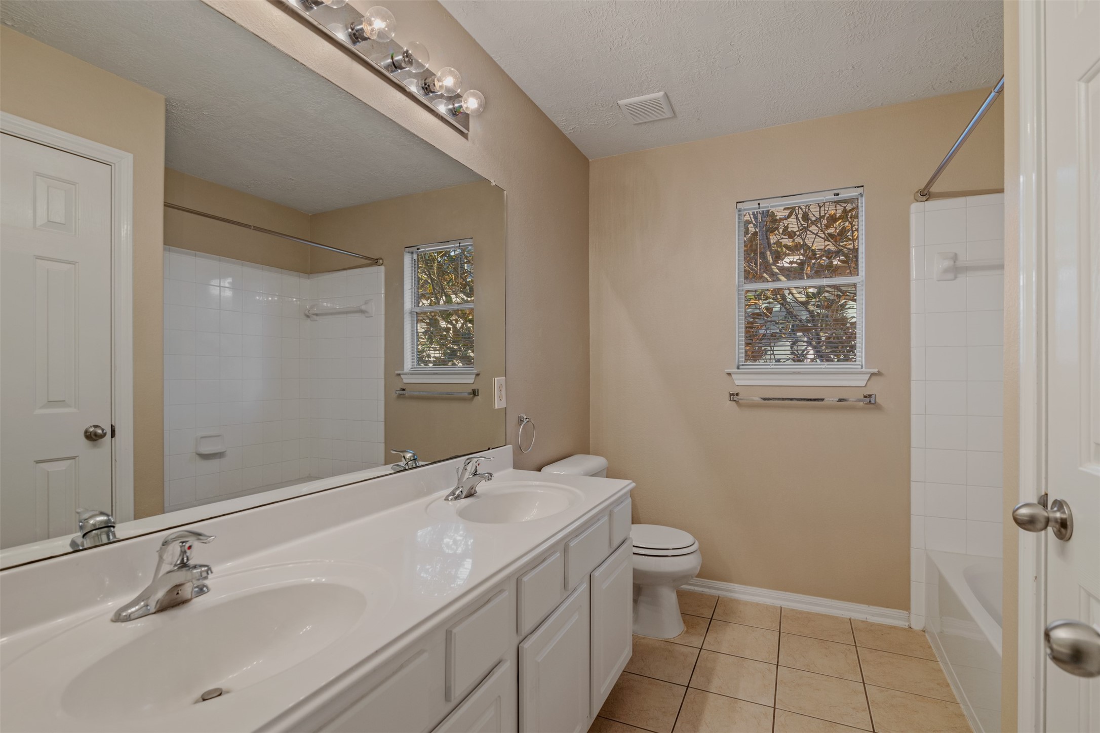 118 Bryce Branch Circle Spring, TX 77382 - Photo 21 of 25 a bathroom with a double vanity sink toilet and a mirror