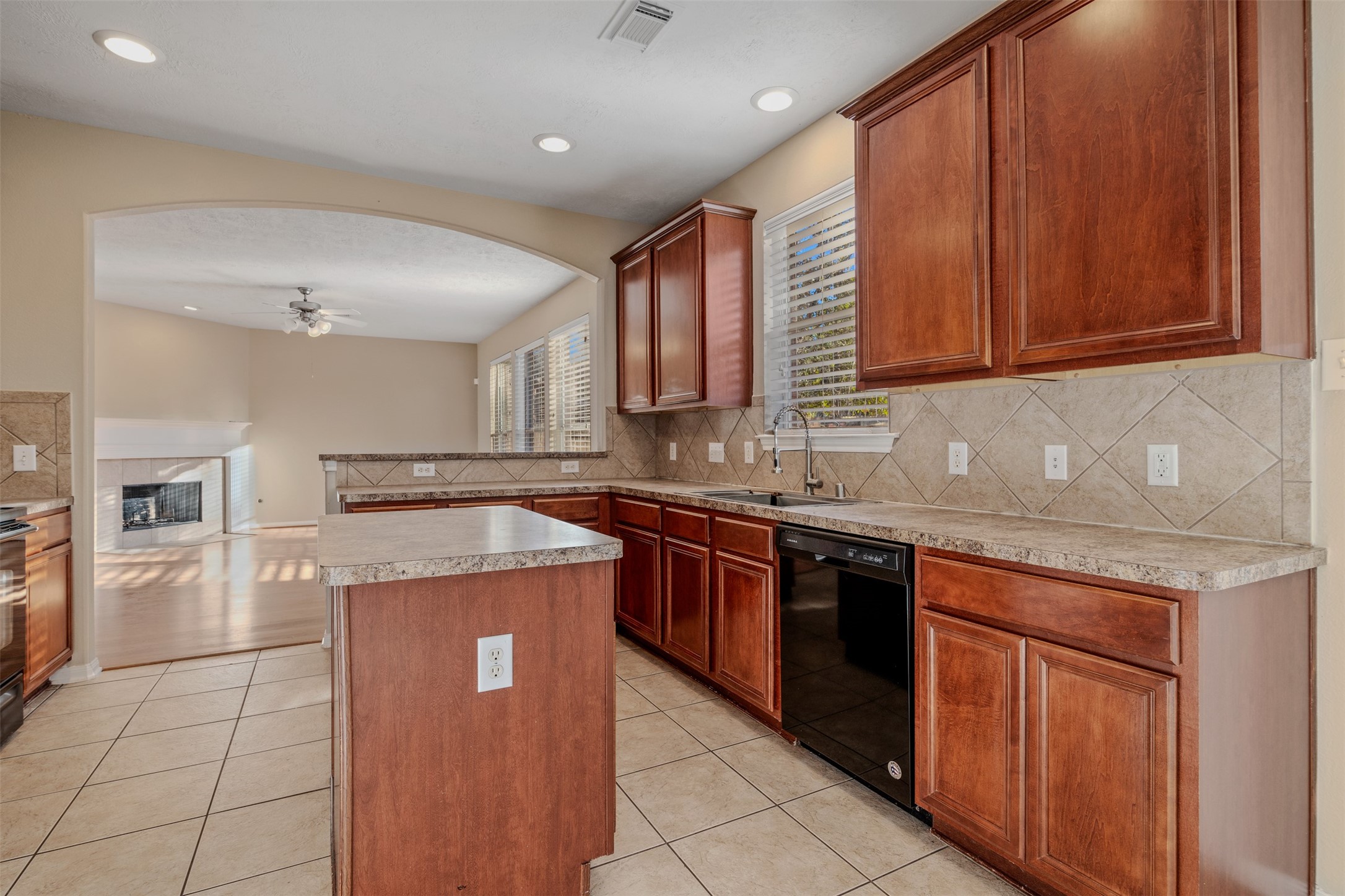 118 Bryce Branch Circle Spring, TX 77382 - Photo 10 of 25 a kitchen with a stove top oven sink and cabinets