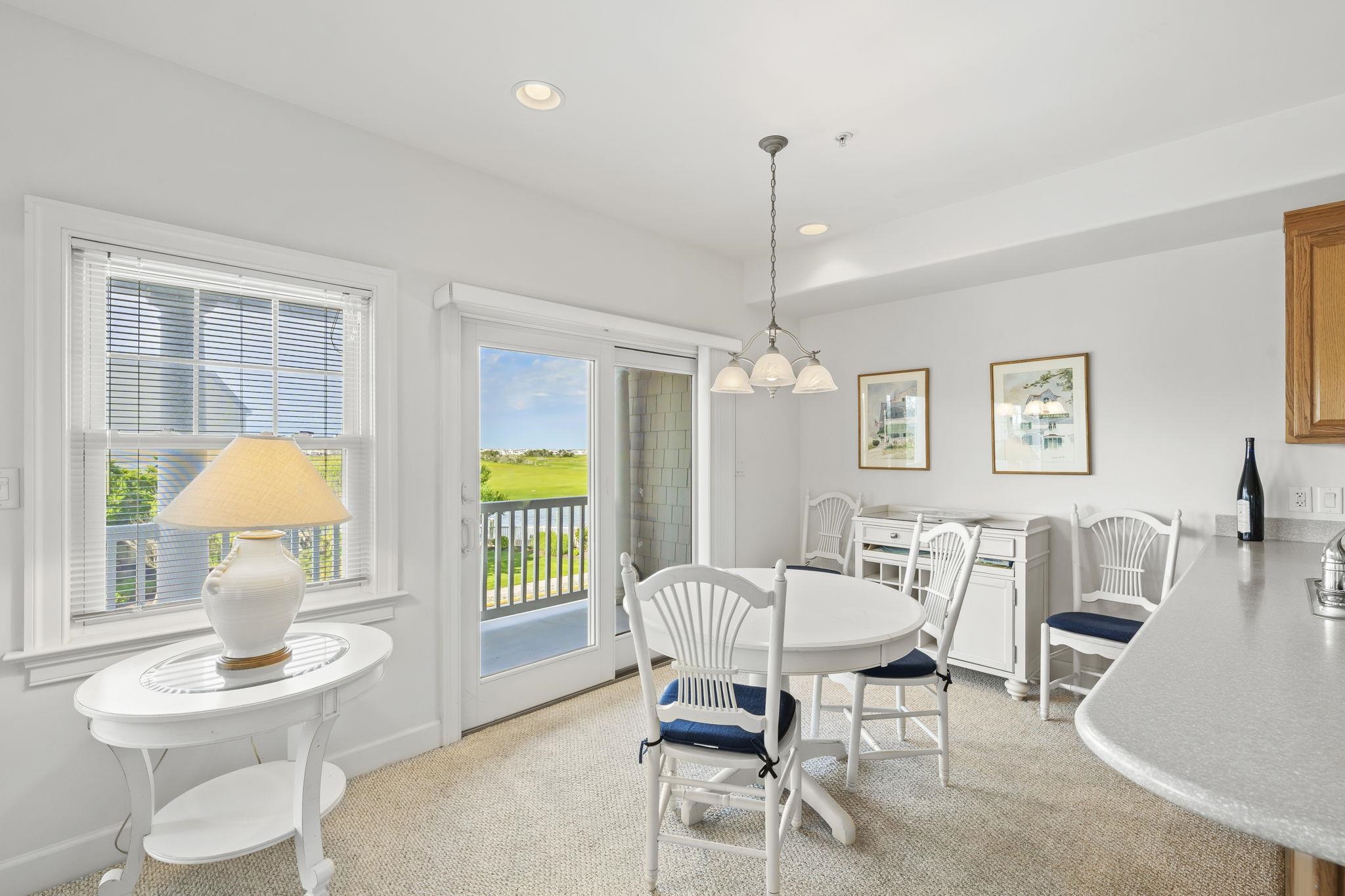 700 Ocean Drive, Unit E4 Avalon, NJ 08202 - Photo 11 of 31 a living room with furniture a window and a table