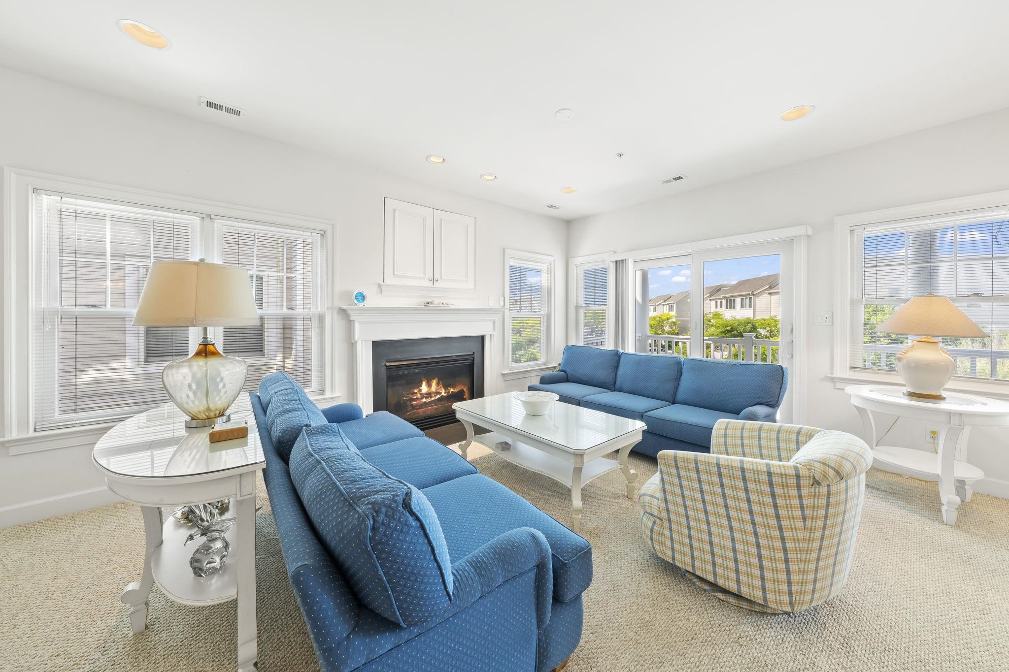 700 Ocean Drive, Unit E4 Avalon, NJ 08202 - Photo 7 of 31 a living room with furniture and a fireplace