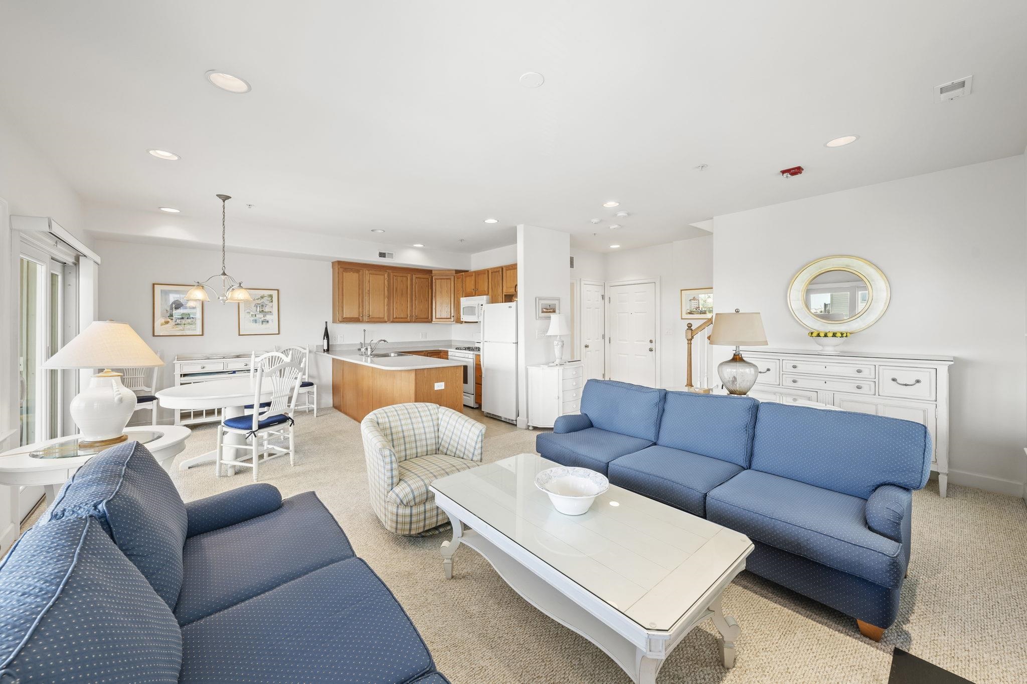 700 Ocean Drive, Unit E4 Avalon, NJ 08202 - Photo 9 of 31 a living room with furniture kitchen view and a chandelier