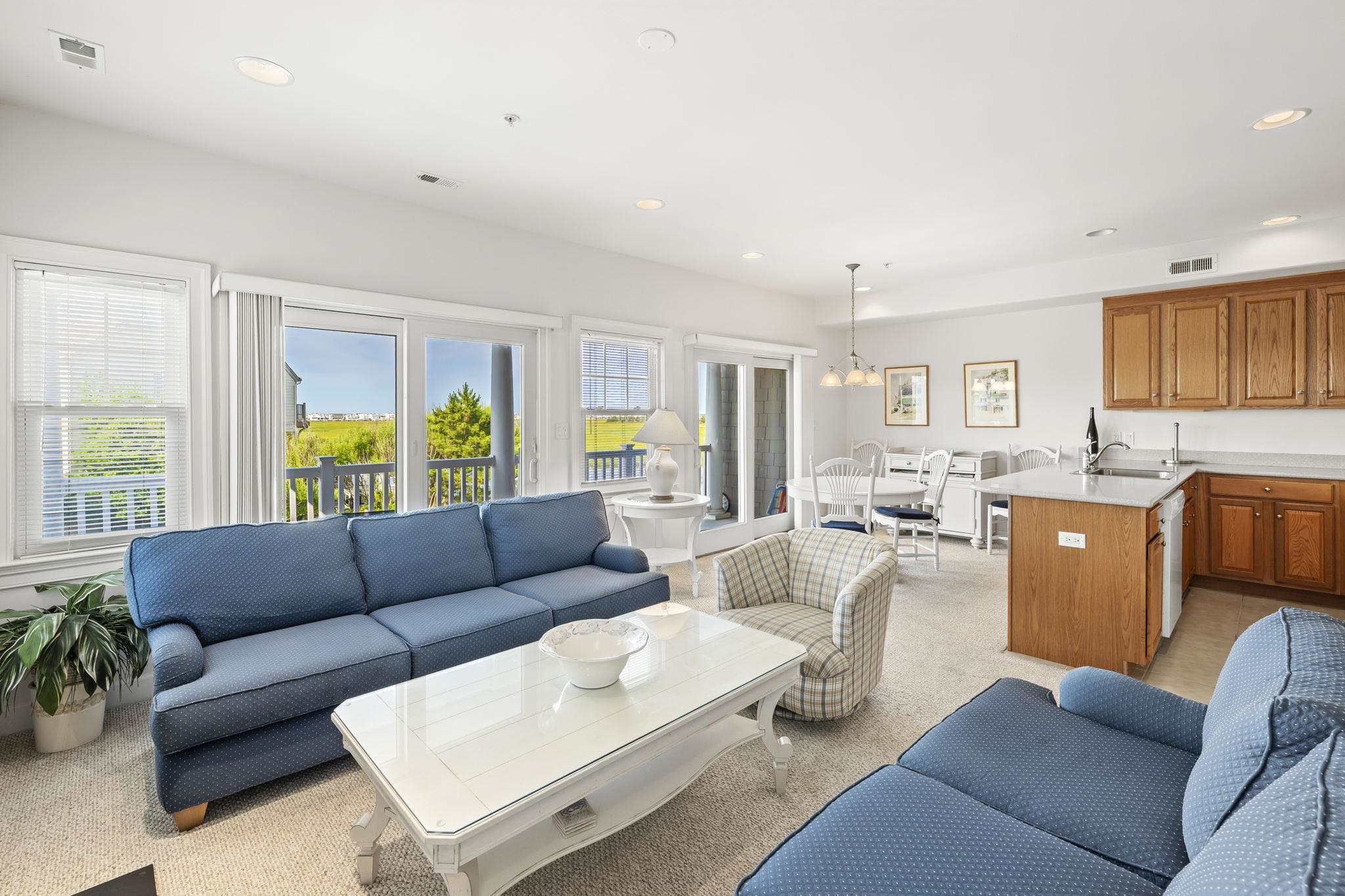 700 Ocean Drive, Unit E4 Avalon, NJ 08202 - Photo 10 of 31 a living room with furniture and a large window