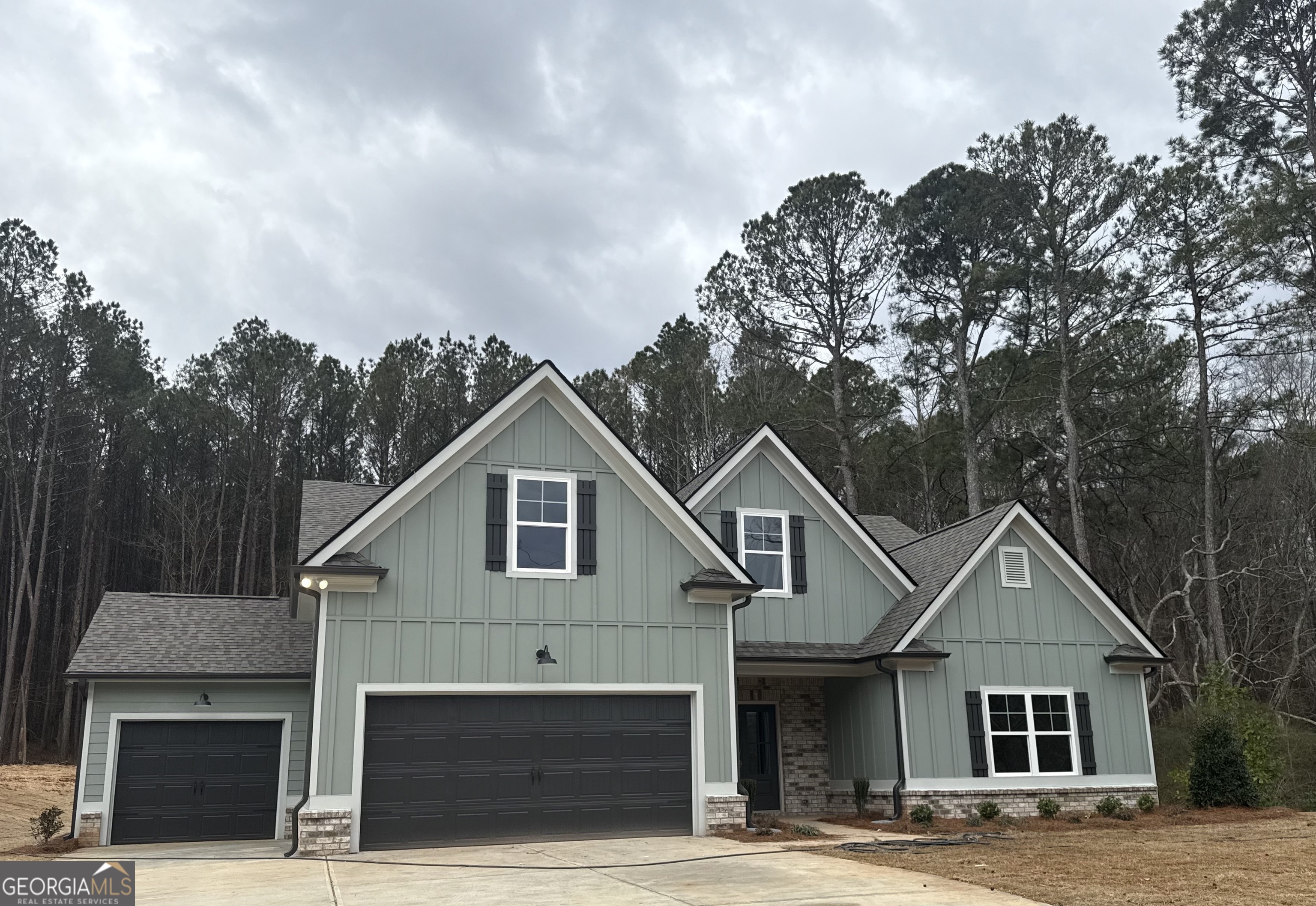 a front view of a house with a garage