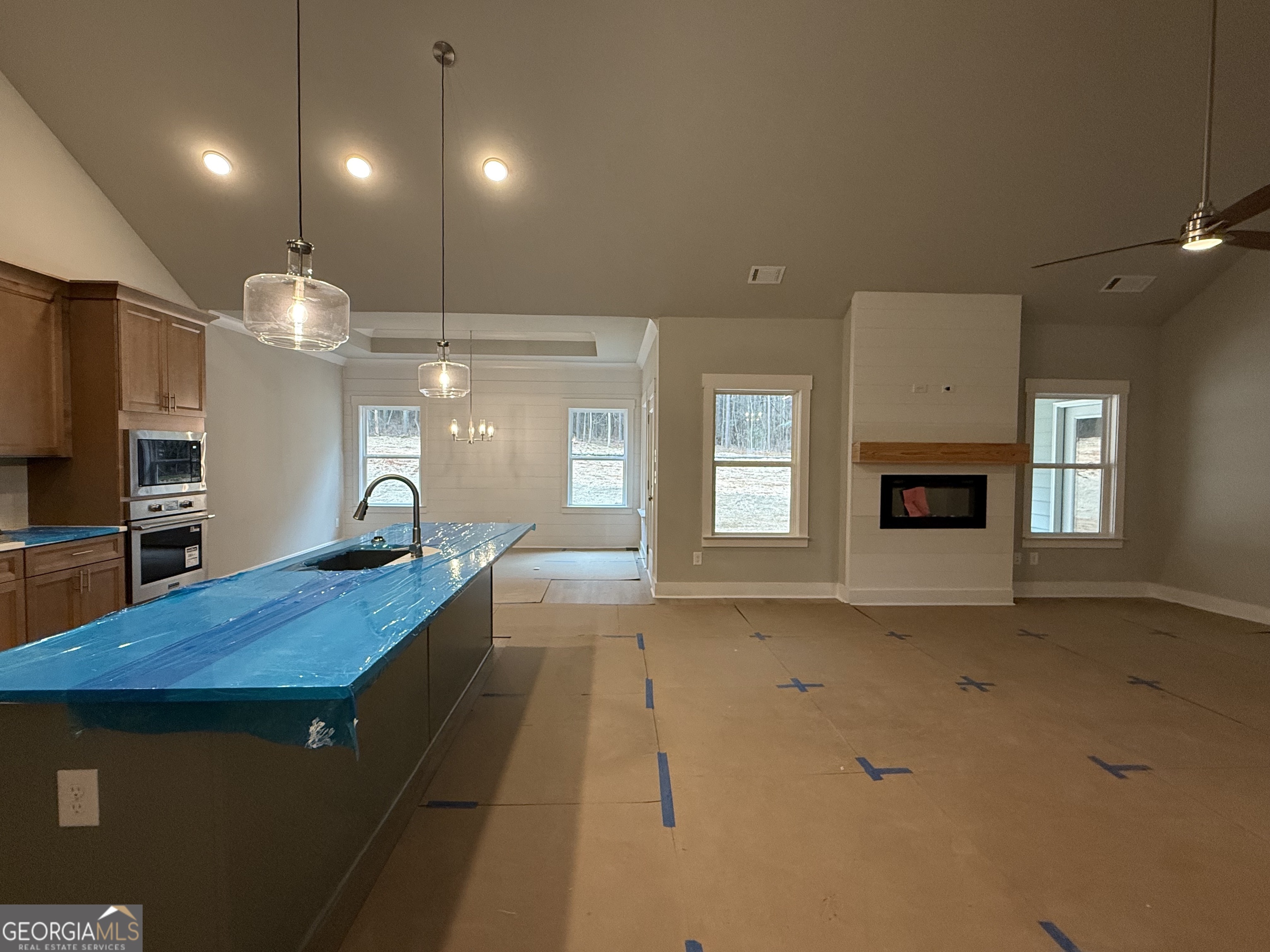 404 Tanners Bridge Road Bethlehem, GA 30620 - Photo 4 of 9 a view of a room with a fireplace cabinet and windows