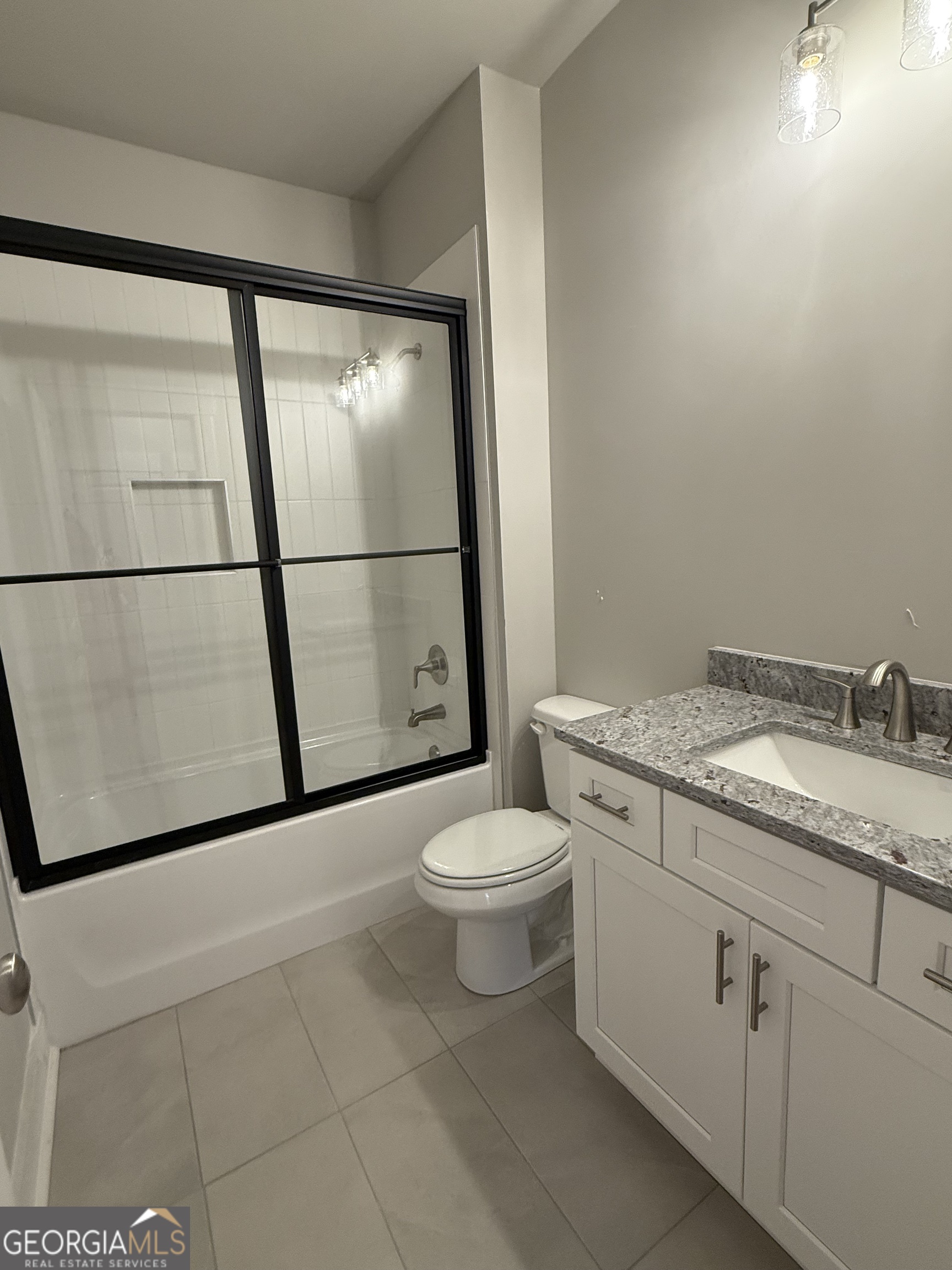 404 Tanners Bridge Road Bethlehem, GA 30620 - Photo 7 of 9 a bathroom with a granite countertop toilet sink and mirror