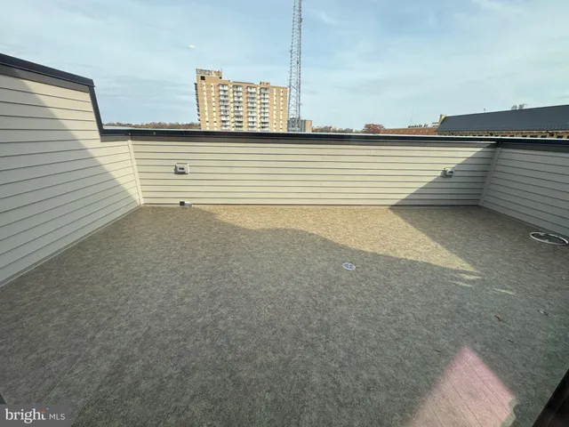 a view of a terrace that has big window