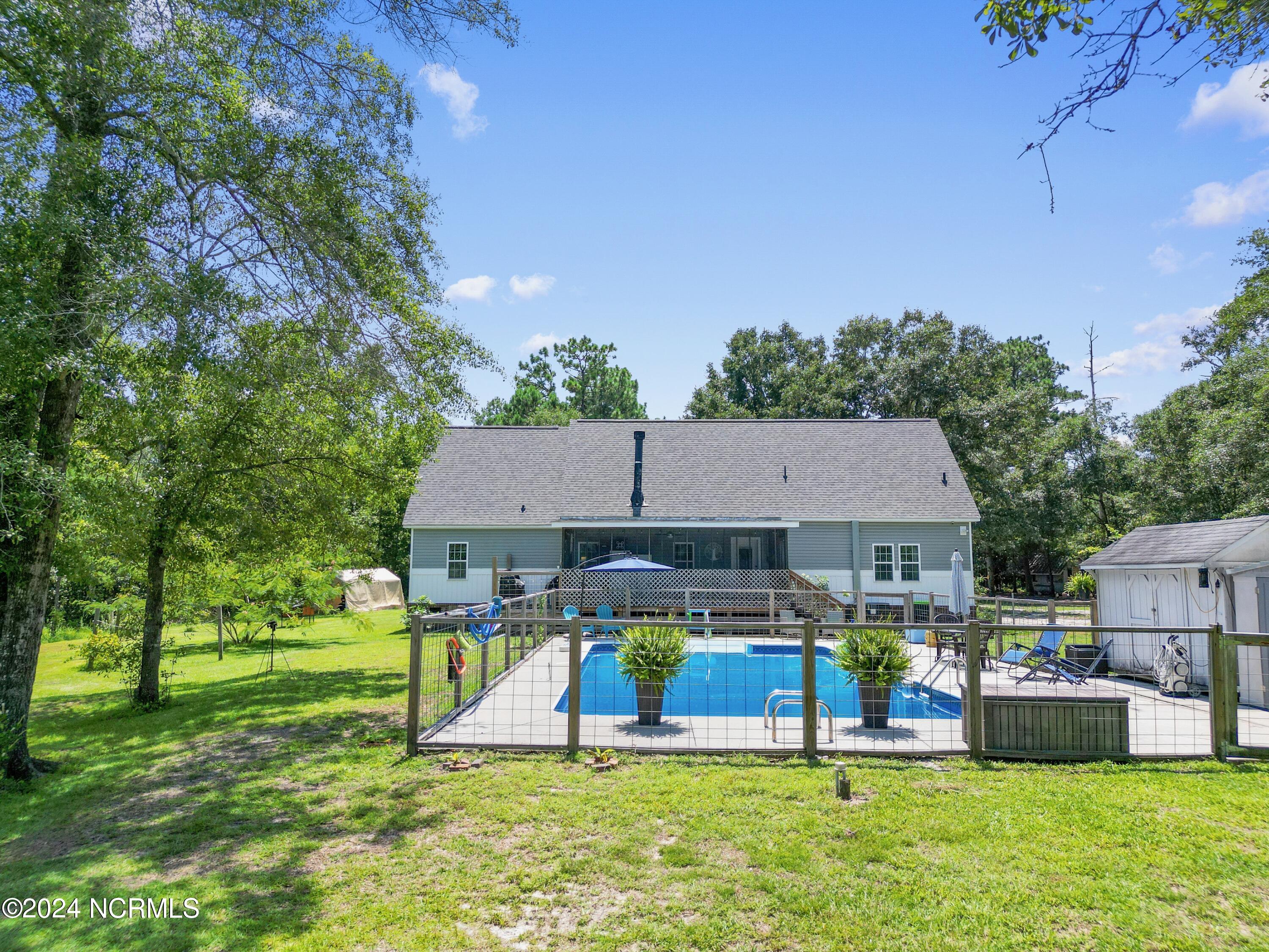 1736 Maco Road Northeast Leland, NC 28451 - Photo 44 of 52 Backyard Pool Area