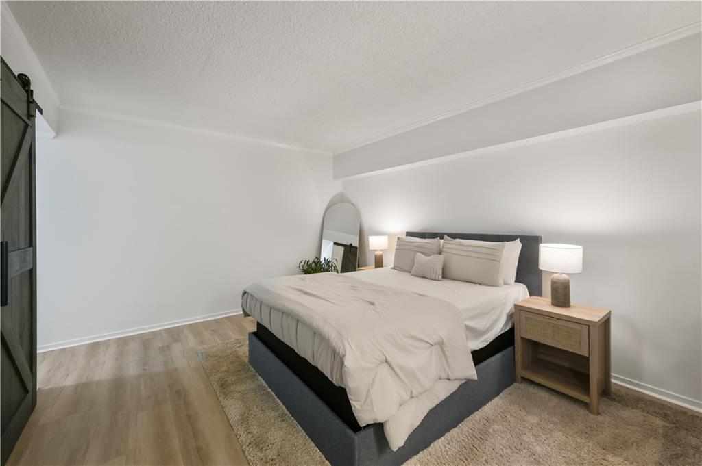3648 Peachtree Road Northeast, Unit 1A Atlanta, GA 30319 - Photo 15 of 36 a bedroom with a bed and window