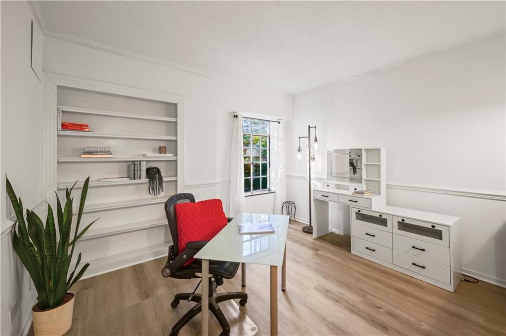 3648 Peachtree Road Northeast, Unit 1A Atlanta, GA 30319 - Photo 19 of 36 a view of a workspace with furniture and wooden floor