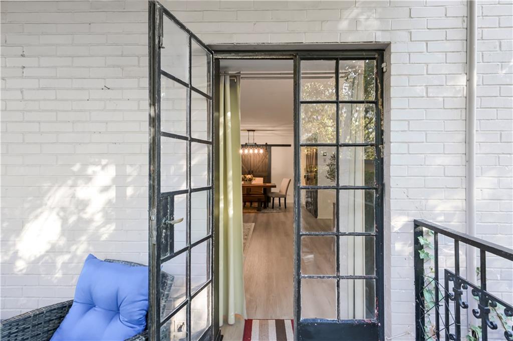3648 Peachtree Road Northeast, Unit 1A Atlanta, GA 30319 - Photo 22 of 36 a view of staircase with white walls and windows