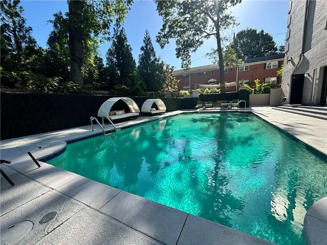 a view of a garden with sitting area