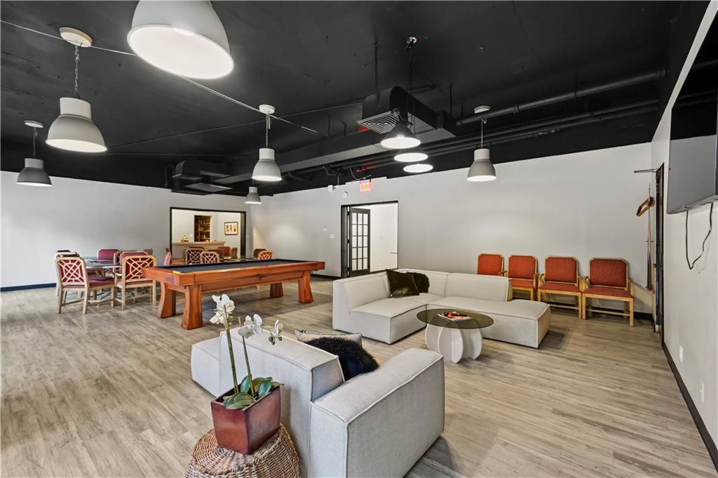3648 Peachtree Road Northeast, Unit 1A Atlanta, GA 30319 - Photo 32 of 36 a living room with lots of furniture and wooden floor