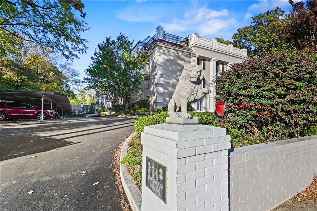 3648 Peachtree Road Northeast, Unit 1A Atlanta, GA 30319 - Photo 36 of 36 a front view of a house with a yard and fountain