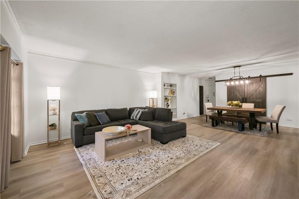 3648 Peachtree Road Northeast, Unit 1A Atlanta, GA 30319 - Photo 5 of 36 a living room with furniture and a wooden floor