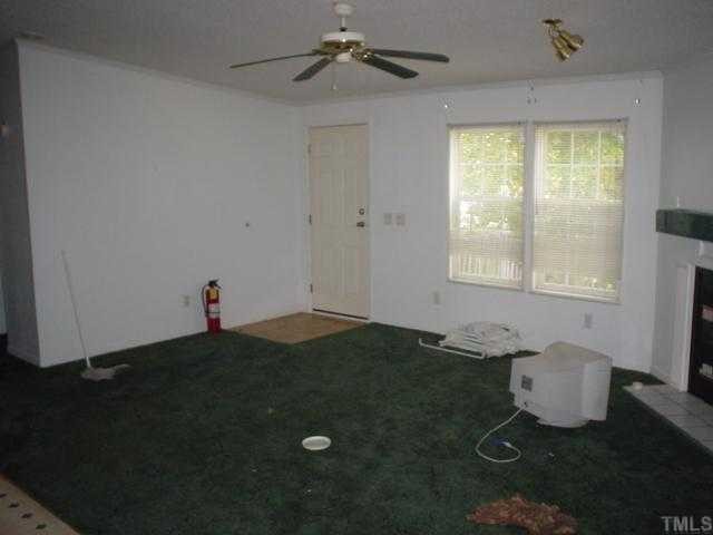 12261 Selma Road Middlesex, NC 27557 - Photo 2 of 6 a view of a livingroom with an empty space and a window