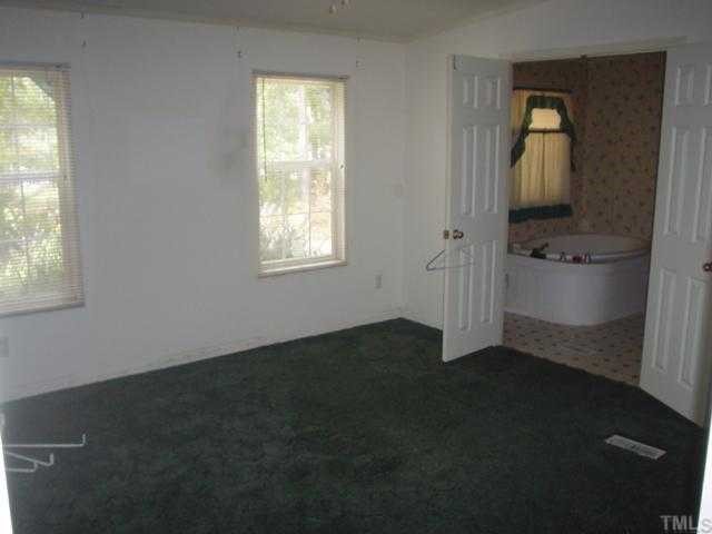 12261 Selma Road Middlesex, NC 27557 - Photo 5 of 6 an empty room with windows