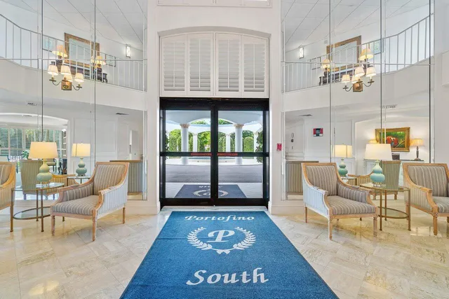 a view of living room with furniture and a rug