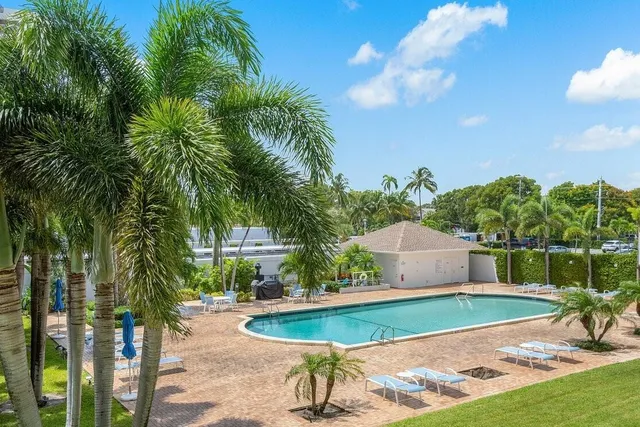 a view of a swimming pool with a patio