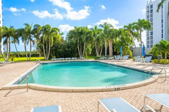 a view of a swimming pool with a sitting space