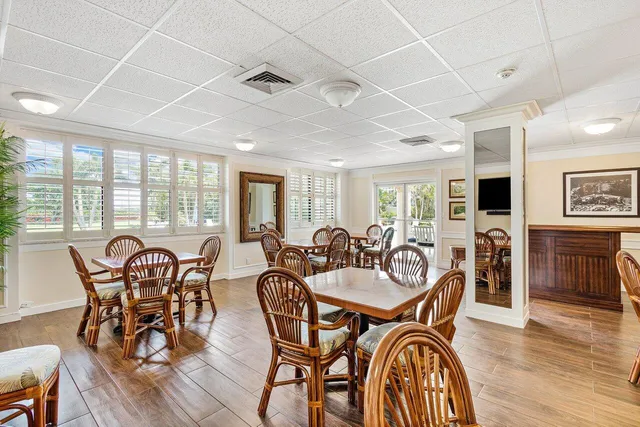a living room with furniture and a book shelf