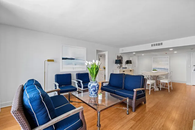 a view of a dining room with furniture and wooden floor