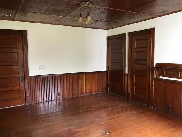 a kitchen with a refrigerator and a stove
