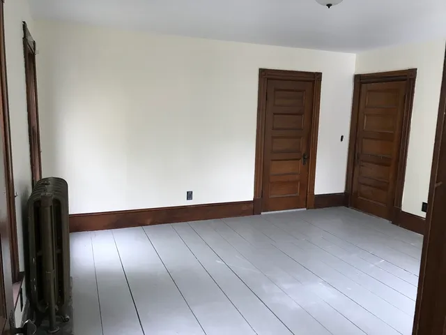 a kitchen with a stove and a cabinet