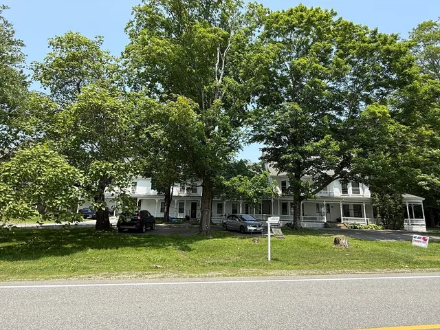 a house with trees in the background