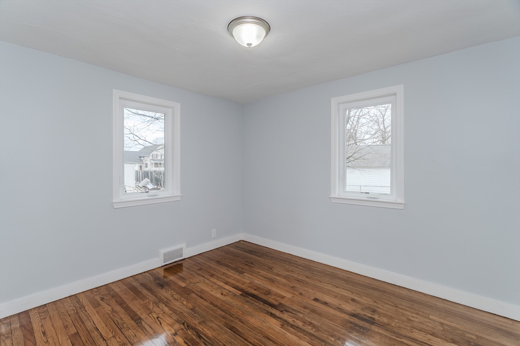 100 Pine Street Ludlow, MA 01056 - Photo 21 of 29 a view of empty room with wooden floor and fan