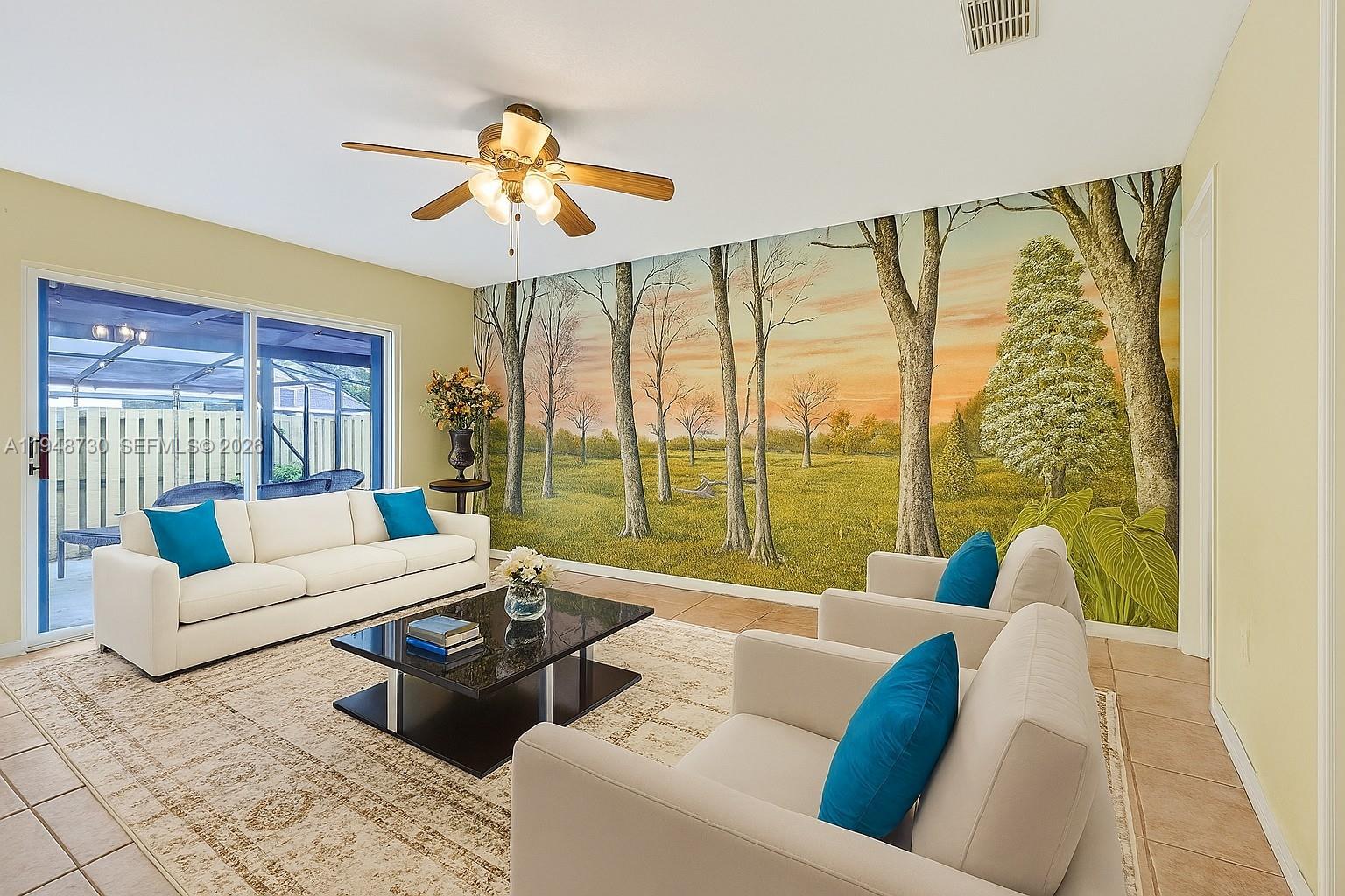5502 Southwest 162nd Place Miami, FL 33185 - Photo 8 of 72 a living room with furniture and a large window