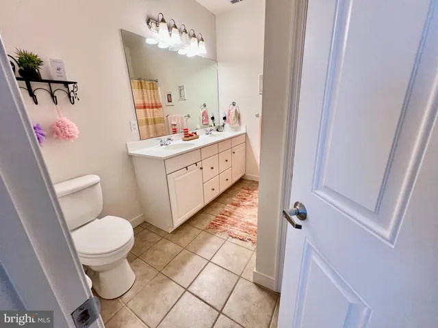 a bathroom with a sink and a shower curtain