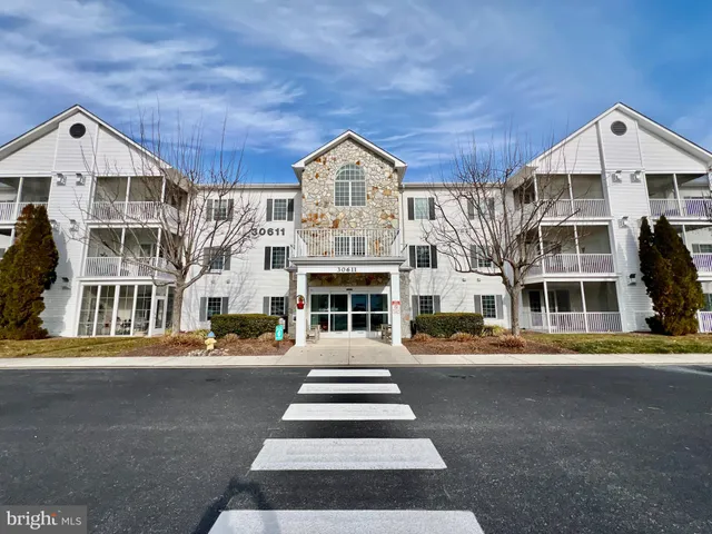 a front view of a building with a porch