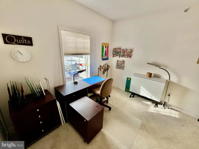 a spacious bathroom with a toilet sink and mirror