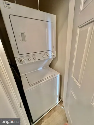 swimming pool view with a seating space and a garden view