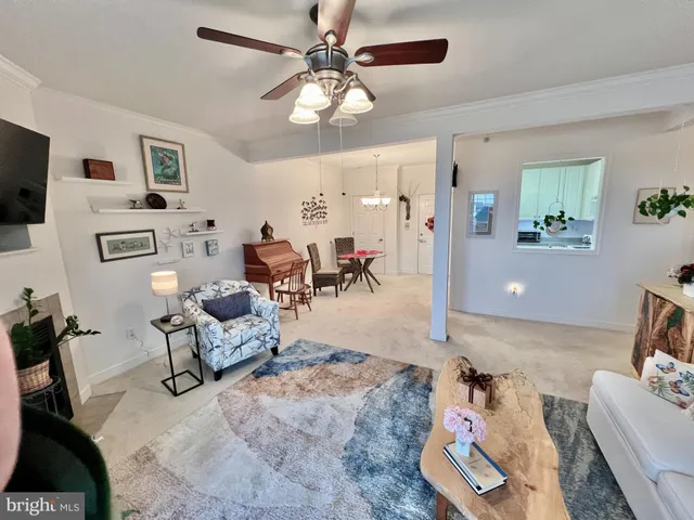 a view of a livingroom with furniture and a chandelier