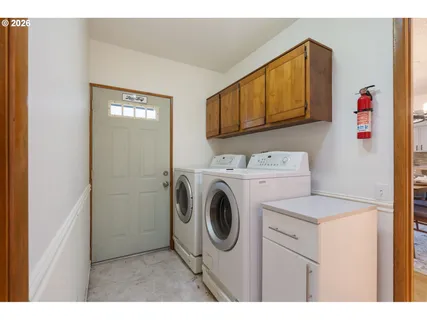 a utility room with dryer and washer