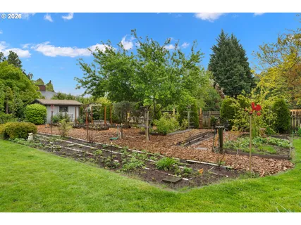 a view of a backyard with sitting area