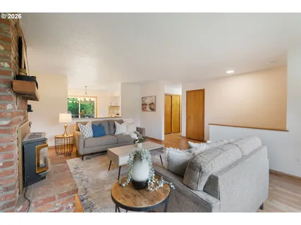 a living room with fireplace furniture and a flat screen tv