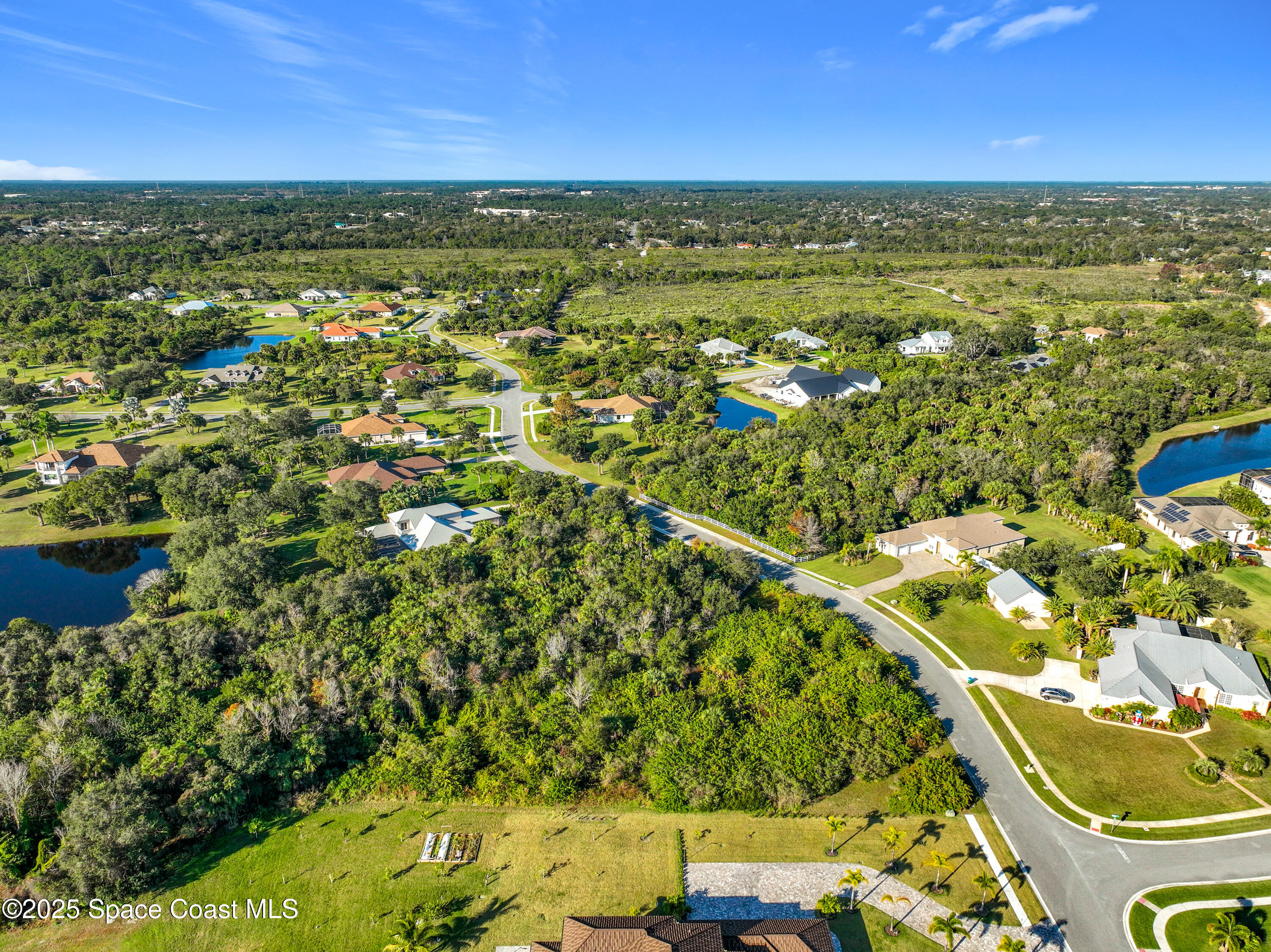1495 Absaroka Lane Malabar, FL 32950 - Photo 14 of 16 a view of a lake with a city